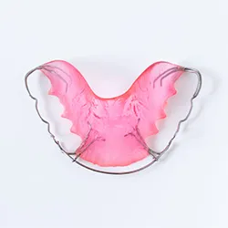 a bright pink dental retainer